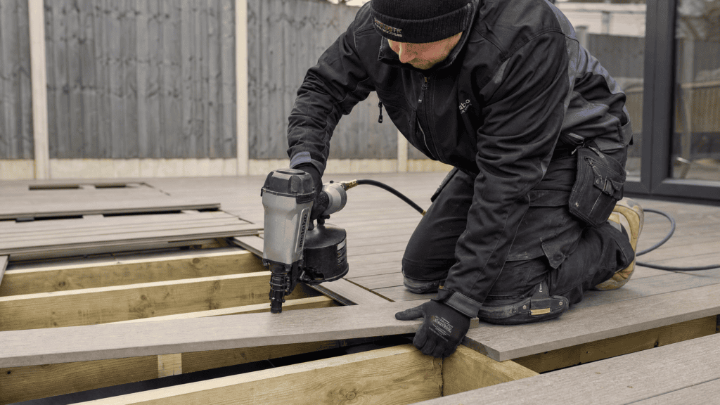 What Is a Coil Nail Gun? Best Coil Nailers & Coil Nailer vs Strip Nailer Explained 3 Installing decking with a coil nailer