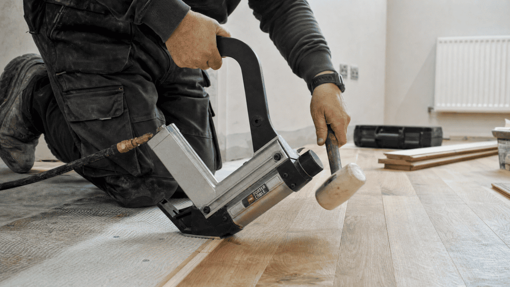 Best Flooring Nailer: Nailing Hardwood Floors How to Guide 1 Flooring Nailer In Use