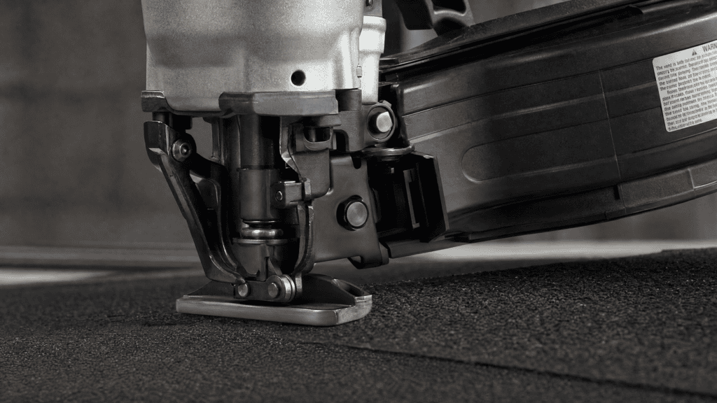 Best Roofing Nailer Guide: What Roofing Nailers Are Used For & How to Use One 5 A pneumatic roofing nailer close-up